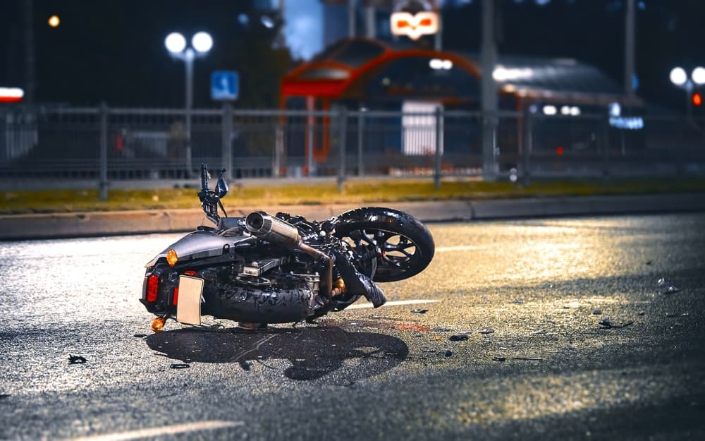 Motorcycle lying on road after an accident.