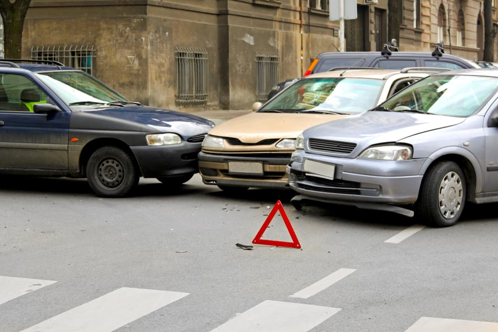 Three-car traffic accident at an intersection.