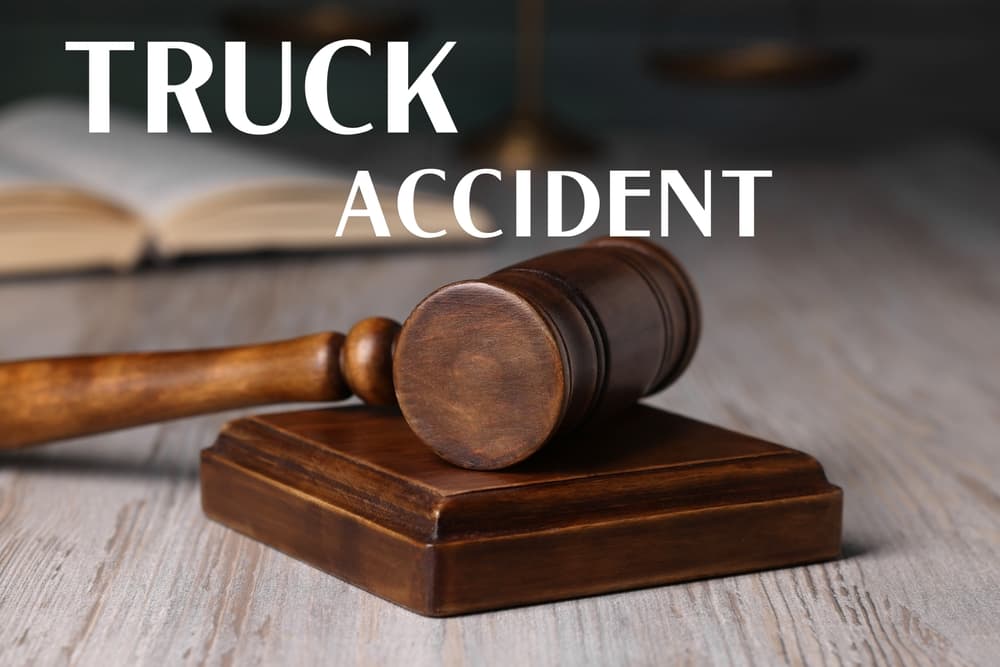 Truck accident law: A judge's gavel resting on a wooden table, symbolizing justice in truck accident cases.